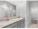 Bathroom vanity with dual sinks, granite countertop, and gray cabinets at 1125 Hallman Branch Ln, Lincolnton, NC 28092