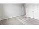 Bright bedroom with neutral carpet flooring and an open closet at 1125 Hallman Branch Ln, Lincolnton, NC 28092