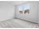 Bedroom with bright windows and carpeted floor at 1125 Hallman Branch Ln, Lincolnton, NC 28092