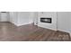 Living room featuring a modern fireplace and beautiful hardwood flooring at 1125 Hallman Branch Ln, Lincolnton, NC 28092