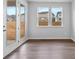 Bright living room with double doors and large windows providing abundant light at 1125 Hallman Branch Ln, Lincolnton, NC 28092