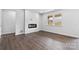 Living room featuring an electric fireplace and large windows providing natural light at 1125 Hallman Branch Ln, Lincolnton, NC 28092