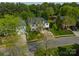 An aerial view of a home with a well-manicured lawn, set in a tranquil, tree-lined neighborhood at 117 Middleton Pl, Mooresville, NC 28117