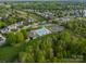 An aerial view of a community pool and clubhouse, surrounded by lush greenery and residential homes at 117 Middleton Pl, Mooresville, NC 28117