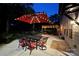Tranquil backyard at night featuring a pergola, patio, and dining area illuminated by string lights at 117 Middleton Pl, Mooresville, NC 28117