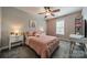 Bedroom with light gray walls, a ceiling fan, large window, and stylish decor at 117 Middleton Pl, Mooresville, NC 28117