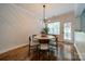 Inviting dining room with modern chandelier and views to backyard at 117 Middleton Pl, Mooresville, NC 28117