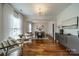 Bright dining room with hardwood floors, modern lighting, and elegant decor at 117 Middleton Pl, Mooresville, NC 28117