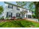 Charming two-story home with white siding, black shutters, and well-manicured landscaping at 117 Middleton Pl, Mooresville, NC 28117