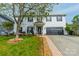 A charming two-story home with classic white siding, dark shutters, and a well-maintained front lawn at 117 Middleton Pl, Mooresville, NC 28117