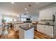 Open-concept kitchen featuring granite countertops, stainless steel appliances, and an island, perfect for entertaining at 117 Middleton Pl, Mooresville, NC 28117