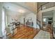 Elegant living room featuring hardwood floors, a staircase, and an open concept dining area at 117 Middleton Pl, Mooresville, NC 28117
