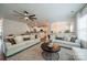 Spacious living room with hardwood floors, comfortable seating, and an open floor plan at 117 Middleton Pl, Mooresville, NC 28117