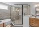 Luxurious bathroom with a glass shower, freestanding tub, tile walls, and wood vanity, creating a spa-like experience at 130 Fordham Ct # 18, Fort Mill, SC 29715