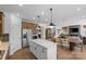 Spacious open-concept kitchen with an island, stainless appliances, and adjacent dining and living areas at 130 Fordham Ct # 18, Fort Mill, SC 29715