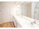 Bright bathroom featuring a long countertop with double sinks and a large mirror at 14849 Santa Lucia Dr, Charlotte, NC 28277