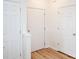 Bright foyer showcasing hardwood floors and multiple interior doors for storage and privacy at 14849 Santa Lucia Dr, Charlotte, NC 28277