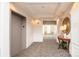 Hallway view showcasing neutral carpeting, trim, and a convenient elevator access at 14849 Santa Lucia Dr, Charlotte, NC 28277