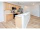 Well-lit kitchen with stainless steel appliances, light wood cabinets, and solid surface countertops at 14849 Santa Lucia Dr, Charlotte, NC 28277
