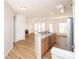 Open-concept kitchen and living area showcasing hardwood floors and modern appliances at 14849 Santa Lucia Dr, Charlotte, NC 28277