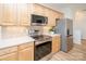 Bright kitchen featuring stainless steel appliances, wood cabinets, and light countertops at 14849 Santa Lucia Dr, Charlotte, NC 28277