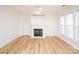 Living room with fireplace, built-ins, and hardwood floors at 14849 Santa Lucia Dr, Charlotte, NC 28277