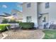 Private backyard patio with brick pavers, seating area, and lush landscaping at 15236 Waterfront Dr, Huntersville, NC 28078
