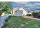 Spacious backyard with well-maintained lawn, brick patio, and mature landscaping at 15236 Waterfront Dr, Huntersville, NC 28078