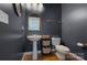 Charming powder room with dark blue walls, pedestal sink, and stylish fixtures at 15236 Waterfront Dr, Huntersville, NC 28078