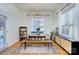 Elegant dining room with modern lighting and large window perfect for entertaining at 15236 Waterfront Dr, Huntersville, NC 28078