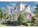 Charming two-story home features a welcoming porch and a well-manicured front yard at 15236 Waterfront Dr, Huntersville, NC 28078