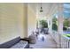 Cozy front porch features seating and a ceiling fan for relaxing outdoor enjoyment at 15236 Waterfront Dr, Huntersville, NC 28078