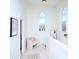 Hallway with architectural windows, artwork, and sitting area at 15236 Waterfront Dr, Huntersville, NC 28078