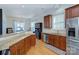 Spacious kitchen with granite counters, stainless steel appliances, wood floors and breakfast bar at 15236 Waterfront Dr, Huntersville, NC 28078