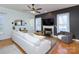 Bright living room featuring a fireplace, hardwood floors, and comfortable seating at 15236 Waterfront Dr, Huntersville, NC 28078