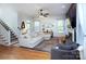 Open-concept living room with hardwood floors, fireplace, and plenty of natural light at 15236 Waterfront Dr, Huntersville, NC 28078