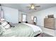 Bedroom with ceiling fan, neutral paint, natural light, and ensuite bathroom at 15236 Waterfront Dr, Huntersville, NC 28078