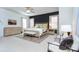 Bright main bedroom with a ceiling fan, natural light, and seating area at 15236 Waterfront Dr, Huntersville, NC 28078