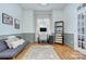 Bright home office with large window and hardwood flooring perfect for remote work at 15236 Waterfront Dr, Huntersville, NC 28078