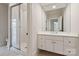 Modern bathroom with glass shower, neutral tile and flooring, and a single sink with vanity at 15603 Mccullers Ct, Charlotte, NC 28277
