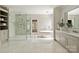 Bright bathroom with a glass shower, a soaking tub, and a double vanity at 15603 Mccullers Ct, Charlotte, NC 28277
