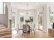 Bright breakfast nook with bay windows and contemporary dining set at 15603 Mccullers Ct, Charlotte, NC 28277