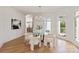 Bright dining area with modern chandelier and chairs and view to backyard at 15603 Mccullers Ct, Charlotte, NC 28277