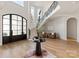 Elegant foyer with a grand staircase, high ceilings, and light hardwood floors at 15603 Mccullers Ct, Charlotte, NC 28277