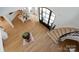 Open foyer with hardwood floors, a spiral staircase, and a glass dining table in the background at 15603 Mccullers Ct, Charlotte, NC 28277