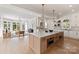 Open concept kitchen with a large island, marble countertops, stainless steel ovens and appliances at 15603 Mccullers Ct, Charlotte, NC 28277
