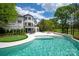 Stunning backyard with a luxurious pool, hot tub, putting green, and views of a golf course at 15603 Mccullers Ct, Charlotte, NC 28277