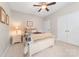 Bedroom features a bed with decorative pillows, bedside table, and a double door closet at 158 Canopy Oak Ln, Statesville, NC 28625