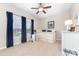 Bright bedroom featuring a ceiling fan, a window with curtains, and a daybed with storage drawers at 158 Canopy Oak Ln, Statesville, NC 28625