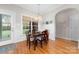Bright breakfast nook with natural light, wainscoting, and hardwood flooring, perfect for casual meals at 158 Canopy Oak Ln, Statesville, NC 28625